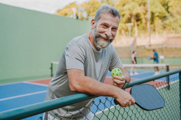 istock Portrait senior man pauses pickleball game 2152316755