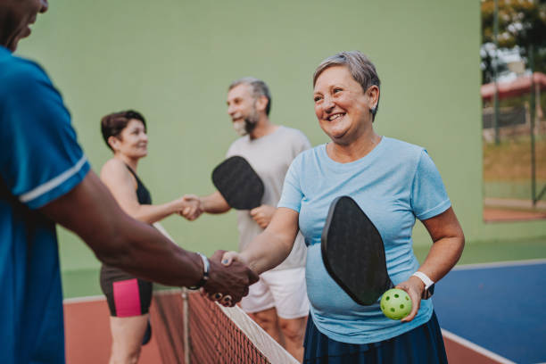 istock Group of people shaking hands ending pickleball game 2152316783