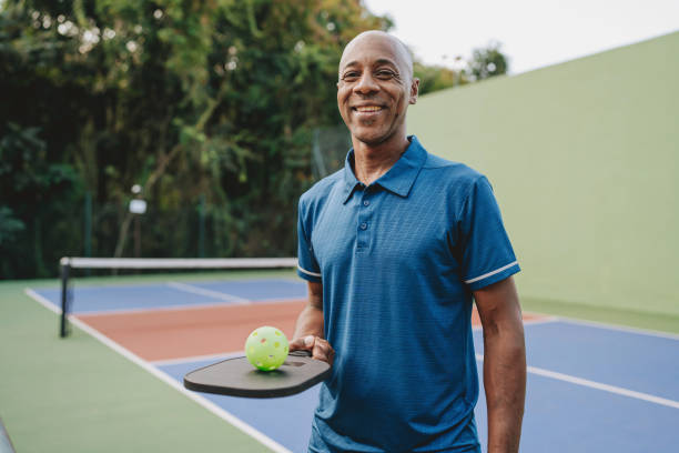 istock Portrait mature man pauses pickleball game 2152316919
