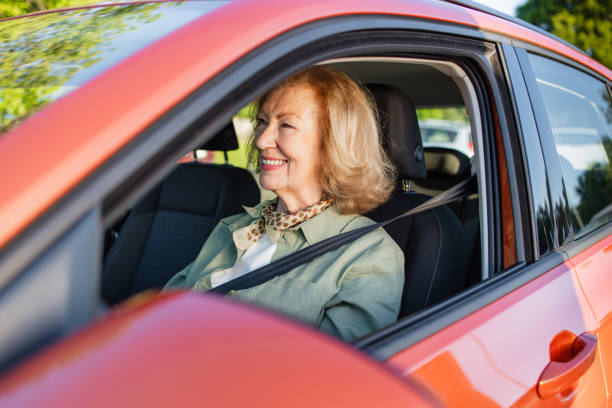 istock Elderly woman driving a car 2152317411