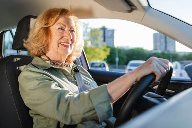 istock Senior woman enjoy driving a car 2152317420