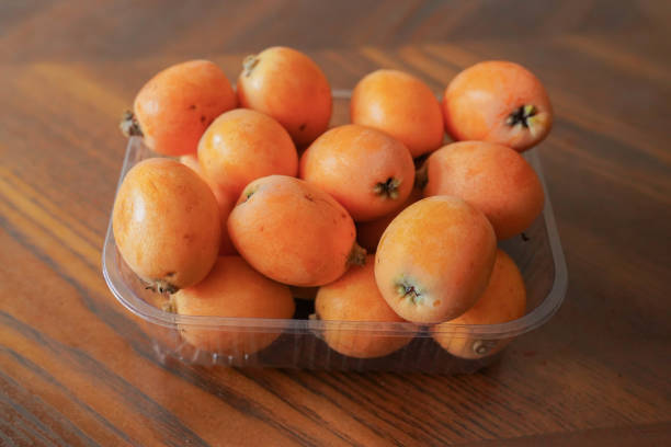 trhee medlars with their own leaves (Eriobotrya japonica)