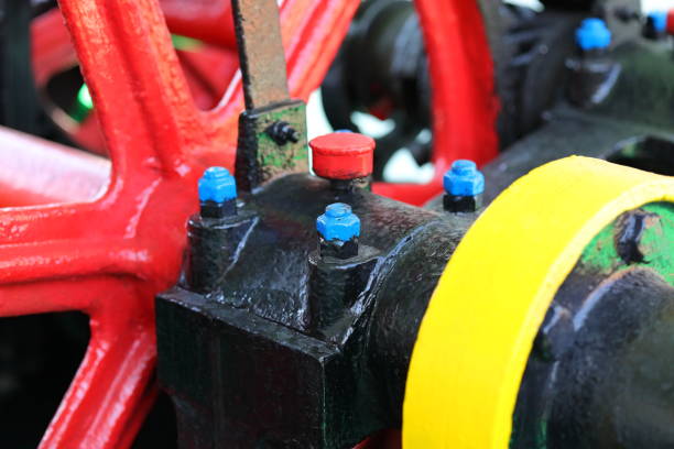 Vintage tractor engine with red faucet