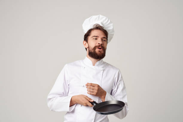 istock male cook kitchen utensils Job Professional 2152321346