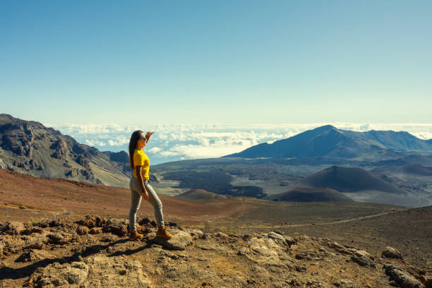 istock Woman standing on the top mountain 2152325601