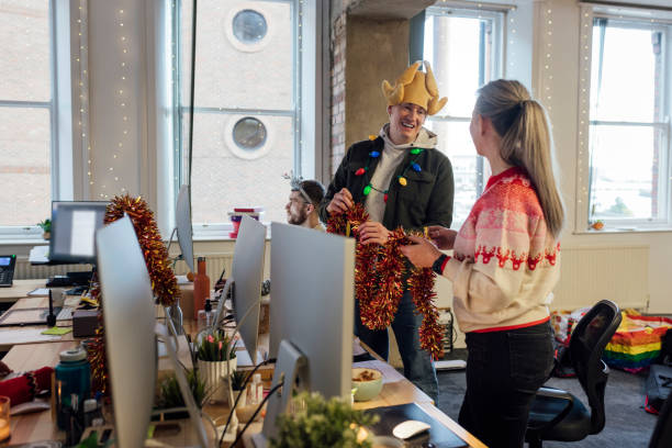 istock Laughing With Coworkers At Christmas 2152328799