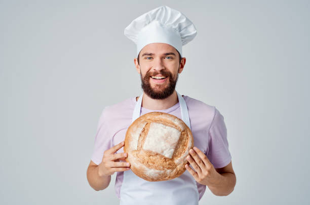 istock a man in a cook's uniform with bread in his hands baking cooking work 2152331806