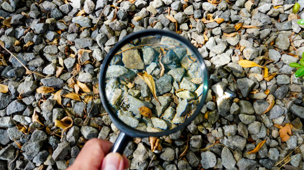 istock Hands holding a magnifying glass up close 2152332412