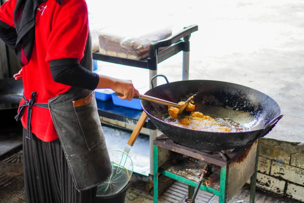 istock Preparing fried tofu in kitchen. Cooking on the fire 2152333186