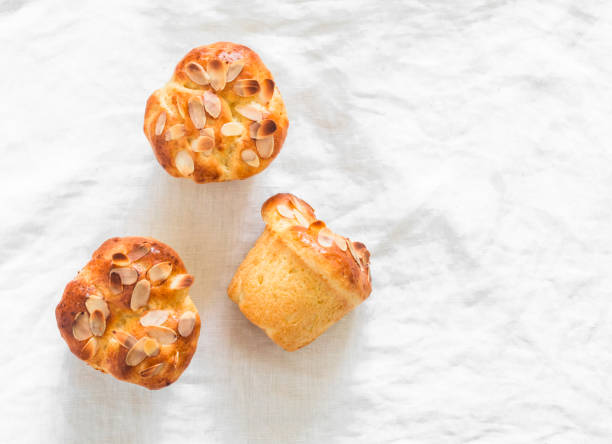 istock Fresh pastries - brioche buns on a light background, top view 2152334511