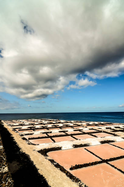 istock A rocky beach with a cloudy sky in the background 2152337352