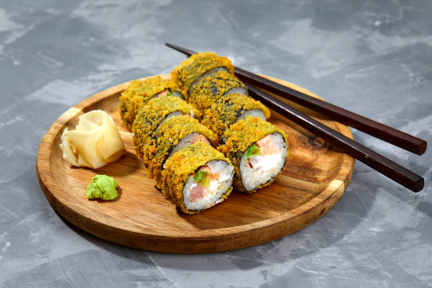 istock Tempura Maki Sushi Deep Fried Sushi Roll Served on wooden board 2152338590