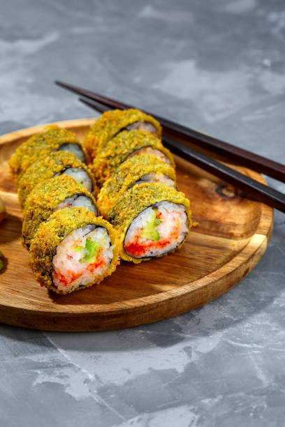istock Tempura Maki Sushi Deep Fried Sushi Roll Served on wooden board 2152338652