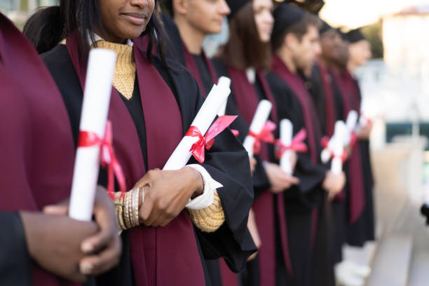 istock Ceremonial gowns and diplomas 2152341913