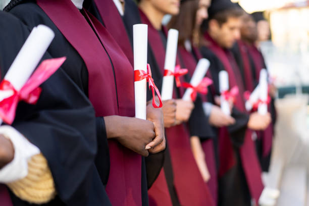 istock A row of graduates holding their diplomas 2152341928