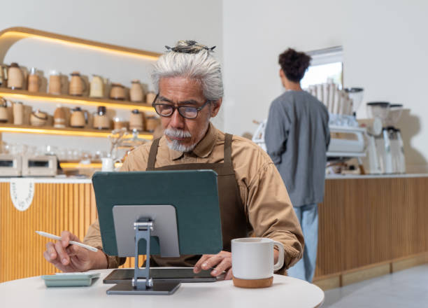 istock Senior owner calculating expenses for business 2152342316