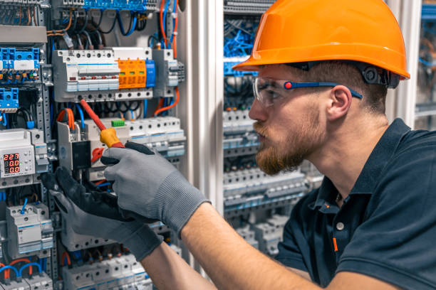 istock Male electrician working in a switchboard with fuses. 2152344955