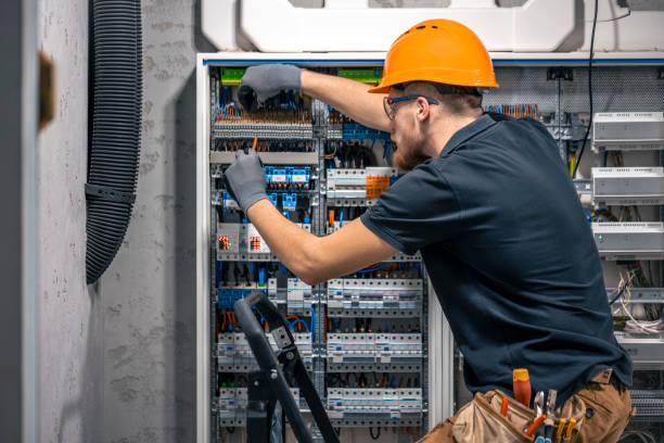 istock Male electrician working in a switchboard with fuses. 2152344958