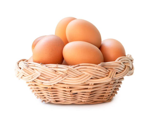 istock Front view of brown chicken eggs in stack in wicker basket isolated on white background with clipping path 2152351141