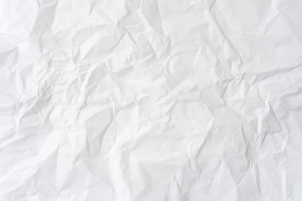 istock Wrinkled or crumpled white stencil paper or tissue paper after use with large copy space used for background texture in decorative art work 2152351833