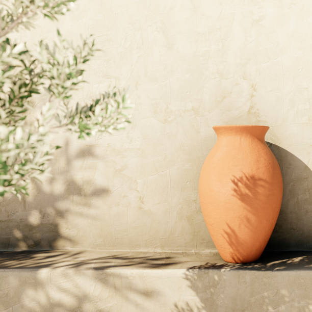 istock Olive tree shadow on beige rustic wall with clay pot. Summer mediterranean traditional home architecture design, neutral aesthetic. 2152353682