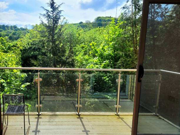 istock View of trees from balcony through door 2152355418