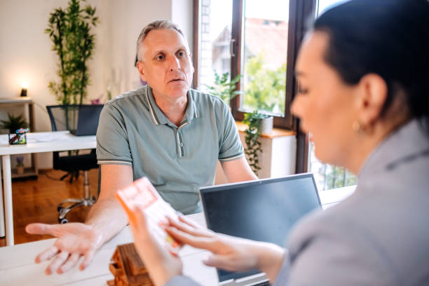 istock Woman talking to a client in the office 2152356437