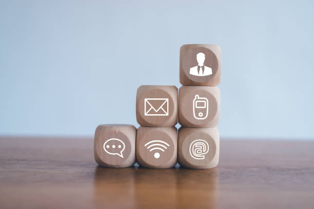 istock Customer support hotline Contact us people connection.Website page contact us or e-mail marketing concept,  Chat message icons. address,call phone, address, Label wood with the email. 2152356570