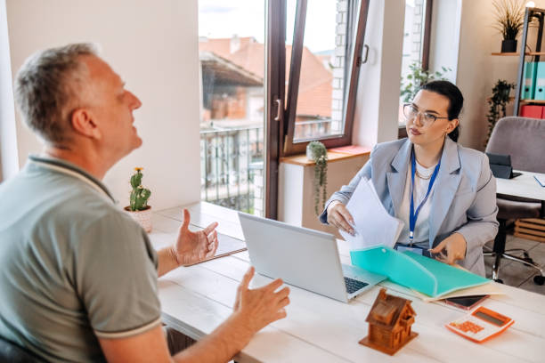 istock Woman talking to a client in the office 2152356845