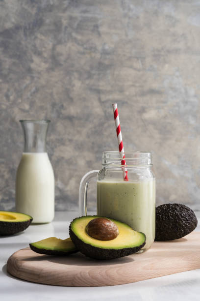 istock healthy avocado smoothie in a glass jar on a grey background 2152357052