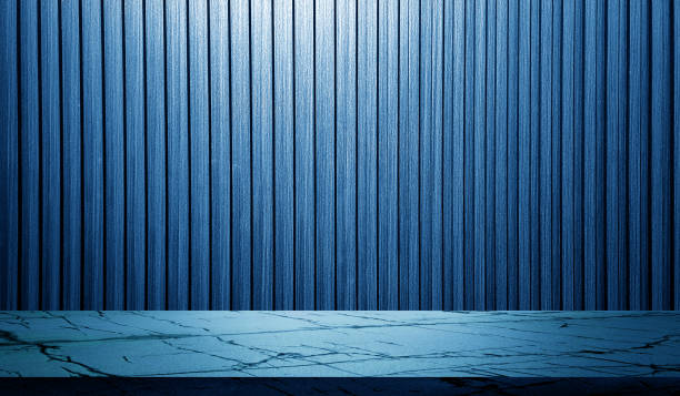 istock carrara marble table in front of blue vertical walnut wooden slats background with blue light from above for product displayed. stone table with wooden in striped line pattern backdrop, monochrome. 2152357280