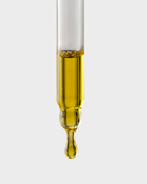 istock Cosmetic pipette with a drop close-up on a gray background 2152358116