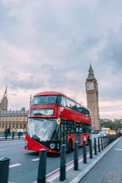 istock Long Exposure Red Double Decker Bus in London near Big Ben 2152359280