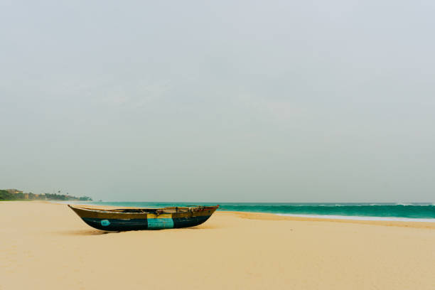 Beautiful landscape of Boat on the beach in cloudy weather. Vintage Boat in the seashore. Azerbaijan Caspian Sea