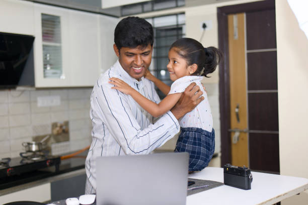 istock indian father helping his little daughter with homework and using laptop at home 2152362982