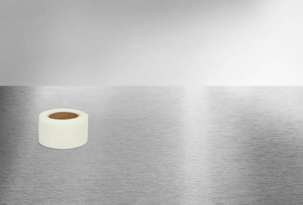 istock White drywall joint mesh tape on an industrial metal background 2152367281