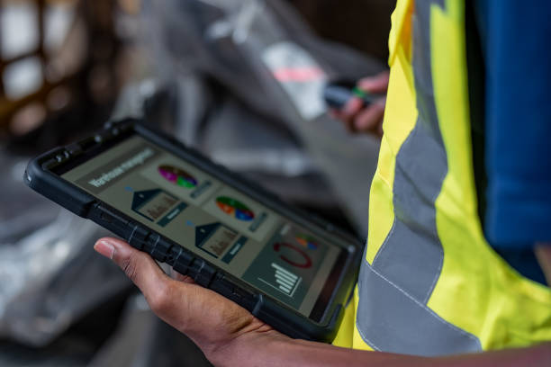 istock Warehouse Worker Monitoring Inventory on Digital Tablet 2152368992