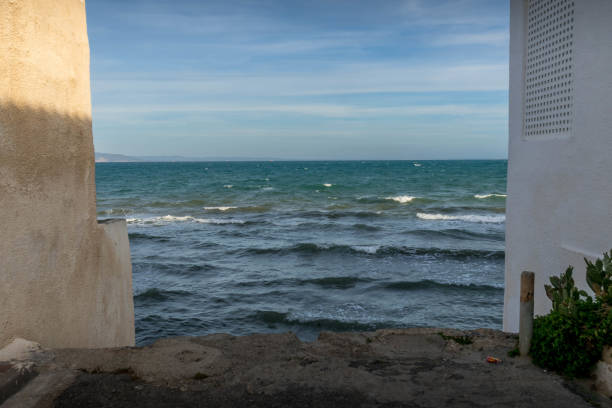 The Mediterranean sea viewed between the building in Tunisia's Carthage neighborhood.