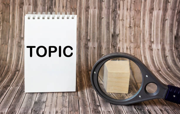 istock The word TOPIC is written on a notepad on a wooden background. 2152372683