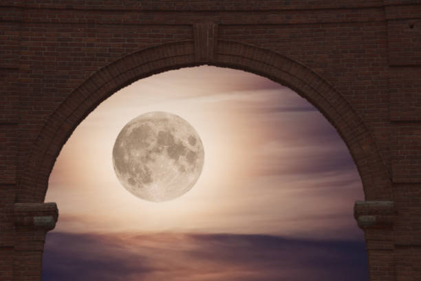 Full moon over the city at night, Baku Azerbaijan. Big full moon shining bright over buildings
