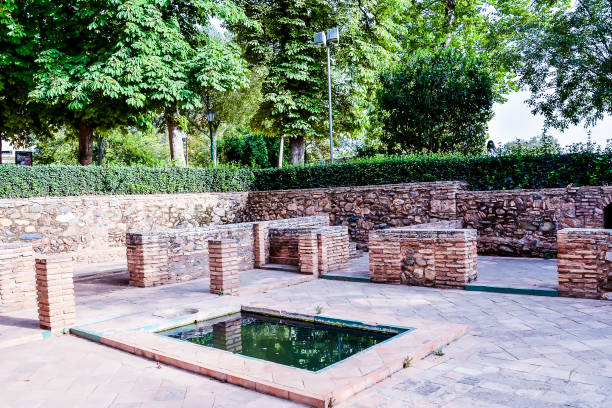 istock A small courtyard with a fountain and a stone wall 2152374995