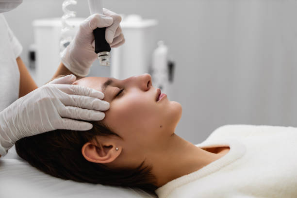 istock A cosmetologist performs hydropiling in a beauty salon. Skin care. 2152377719