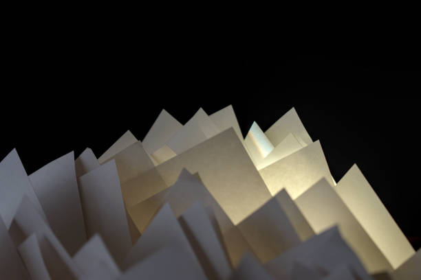 istock pieces of white folded paper on black background 2152379405
