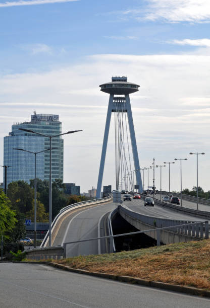 Bratislava, Slovakia, Oct. 7, 2023: Vehicles travel across the Danube River on Bratislava's SNP Bridge, often called the UFO Bridge.