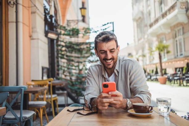 istock A modern young man in casual clothes is using a smartphone to chat with friends 2152391921