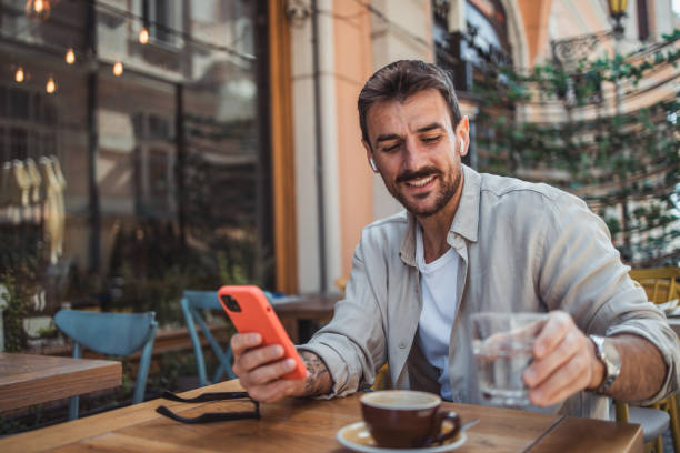 istock A modern young man in casual clothes is using a smartphone to chat with friends 2152391925