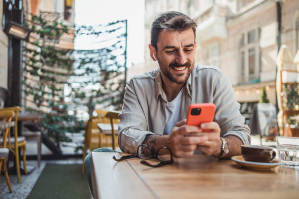 istock A modern young man in casual clothes is using a smartphone to chat with friends 2152391926