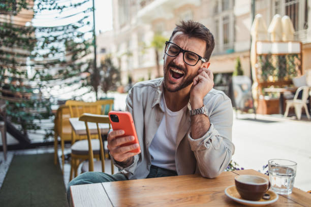 istock A modern young man in casual clothes is using a smartphone to chat with friends 2152391940