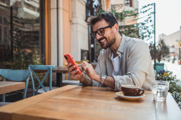 istock A modern young man in casual clothes is using a smartphone to chat with friends 2152391941