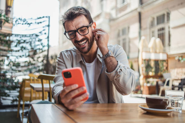 istock A modern young man in casual clothes is using a smartphone to chat with friends 2152391942